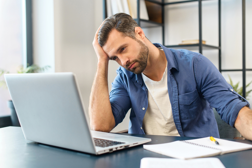 Man Staring Stressed at Computer 